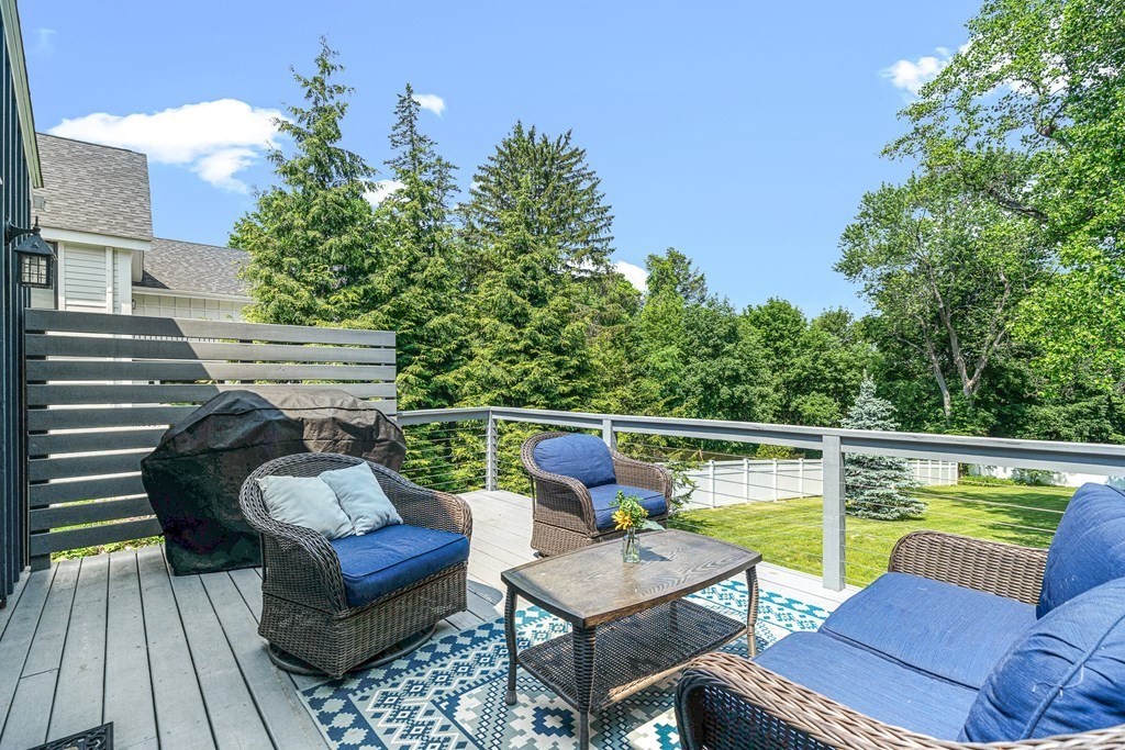 52 Morton Street Andover, MA 01810 - Photo 2 of 27 a view of a patio with couches chairs and a potted plant