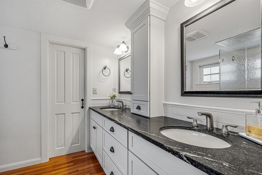 52 Morton Street Andover, MA 01810 - Photo 21 of 27 a bathroom with a granite countertop double vanity sink and a mirror