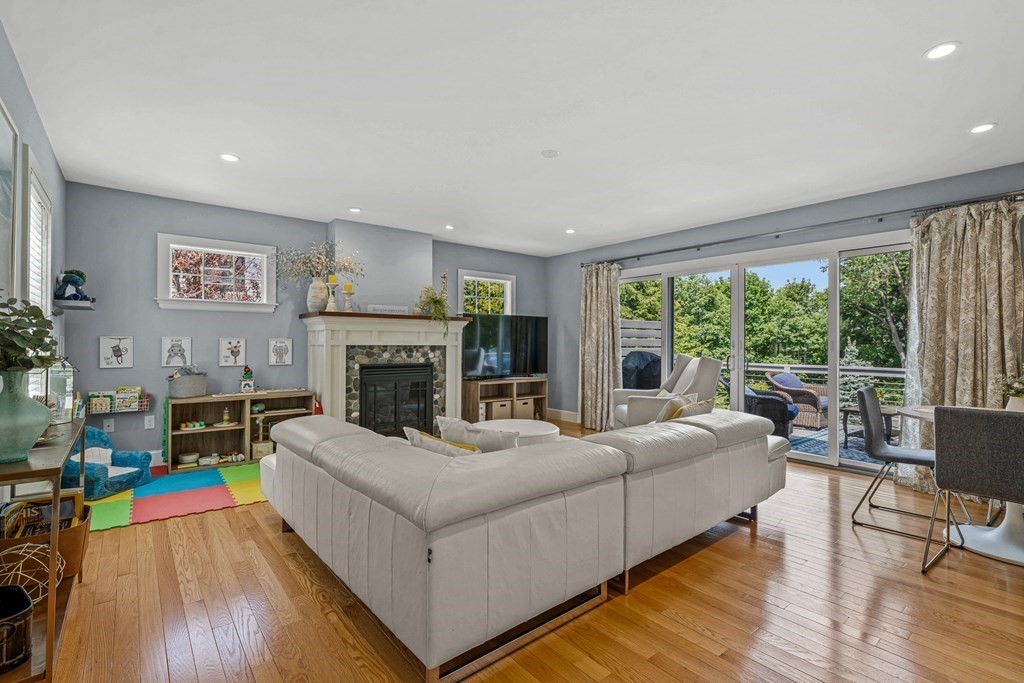 52 Morton Street Andover, MA 01810 - Photo 8 of 27 a living room with furniture and a fireplace