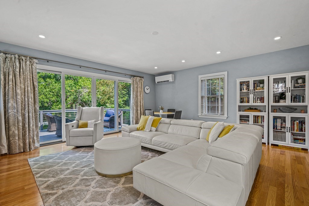 52 Morton Street Andover, MA 01810 - Photo 9 of 27 a living room with furniture and floor to ceiling windows
