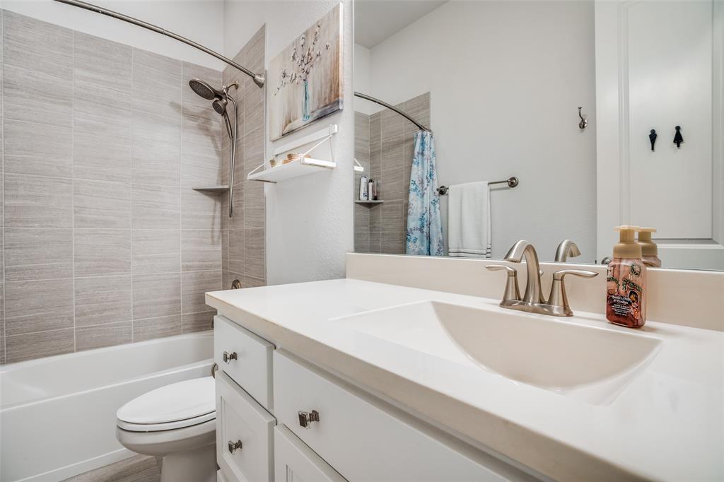 1011 Riviera Road Roanoke, TX 76262 - Photo 20 of 28 Full bath with clean neutral tile and bright vanity
