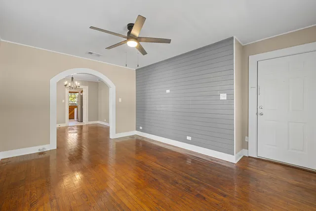 a view of livingroom with hardwood floor and ceiling fan