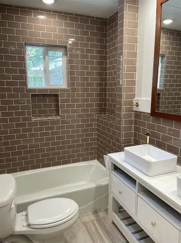 a kitchen with a refrigerator and a sink