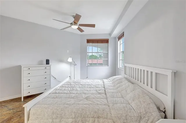 a bedroom with a bed and a dresser