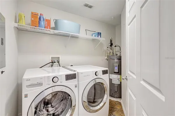 a utility room with dryer and washer