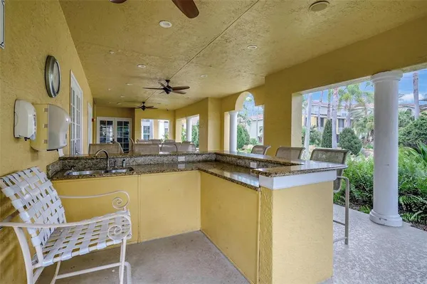 a kitchen with a sink cabinets and wooden floor
