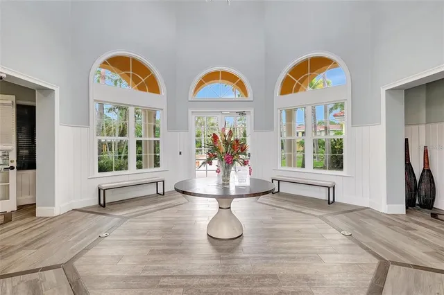 a view of living room with furniture and wooden floor