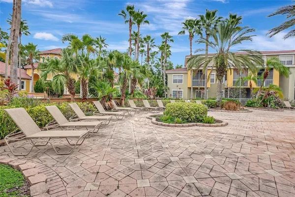a view of a chairs and table in a backyard
