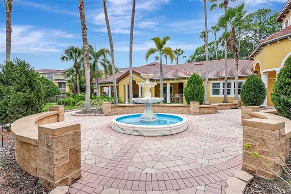 a swimming pool with outdoor seating and yard