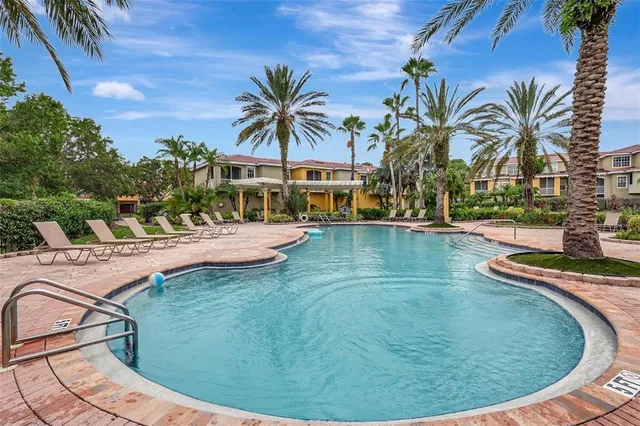 a view of a swimming pool with a patio