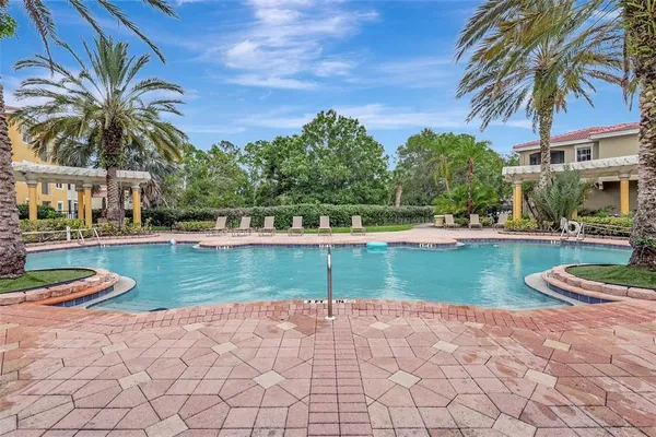 a view of a swimming pool and a yard