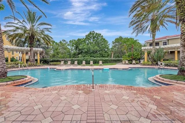 a view of a swimming pool and a yard