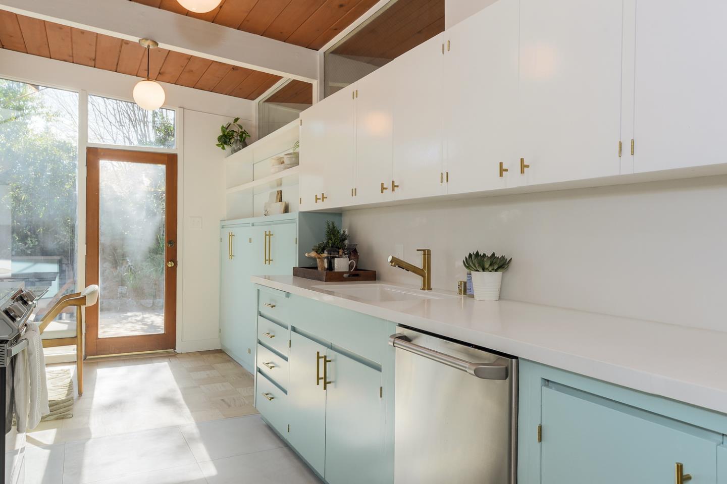 2 Roosevelt Circle Palo Alto, CA 94306 - Photo 16 of 42 a kitchen with granite countertop a sink a stove and cabinets