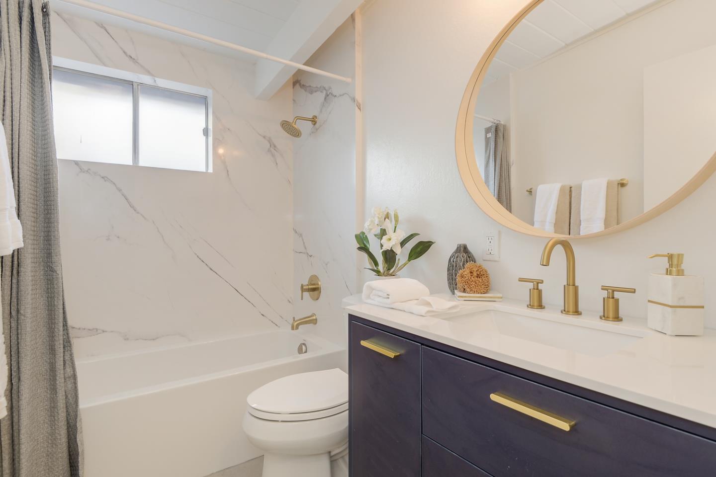 2 Roosevelt Circle Palo Alto, CA 94306 - Photo 24 of 42 a bathroom with a sink a toilet and a mirror