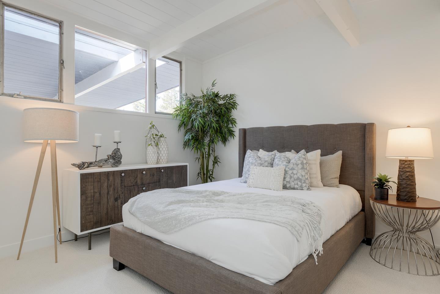 2 Roosevelt Circle Palo Alto, CA 94306 - Photo 28 of 42 a bedroom with a large bed and a potted plant on the dresser
