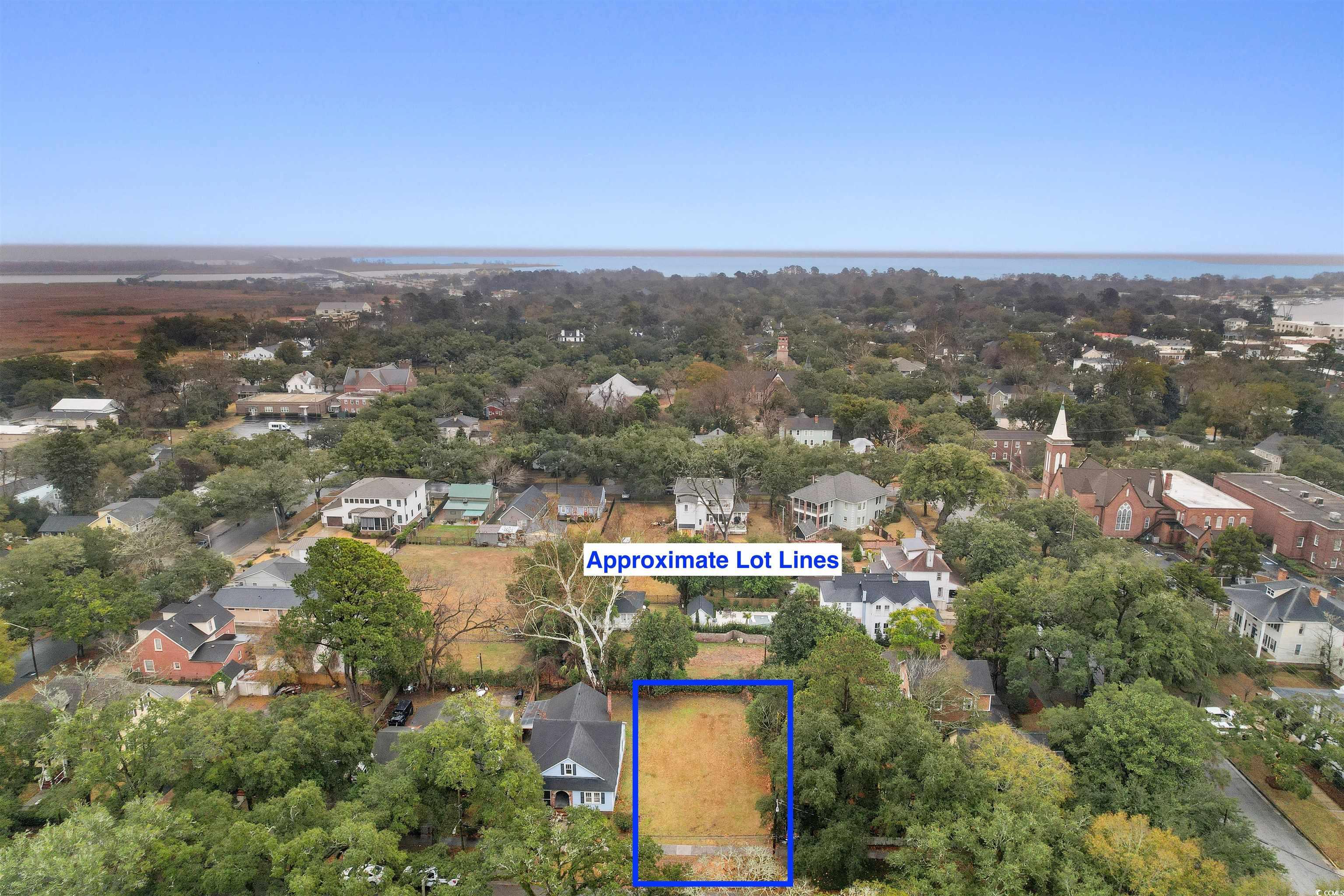 310 King Street Georgetown, SC 29440 - Photo 18 of 23 Aerial perspective of suburban area with property boundaries highlighted and a large body of water