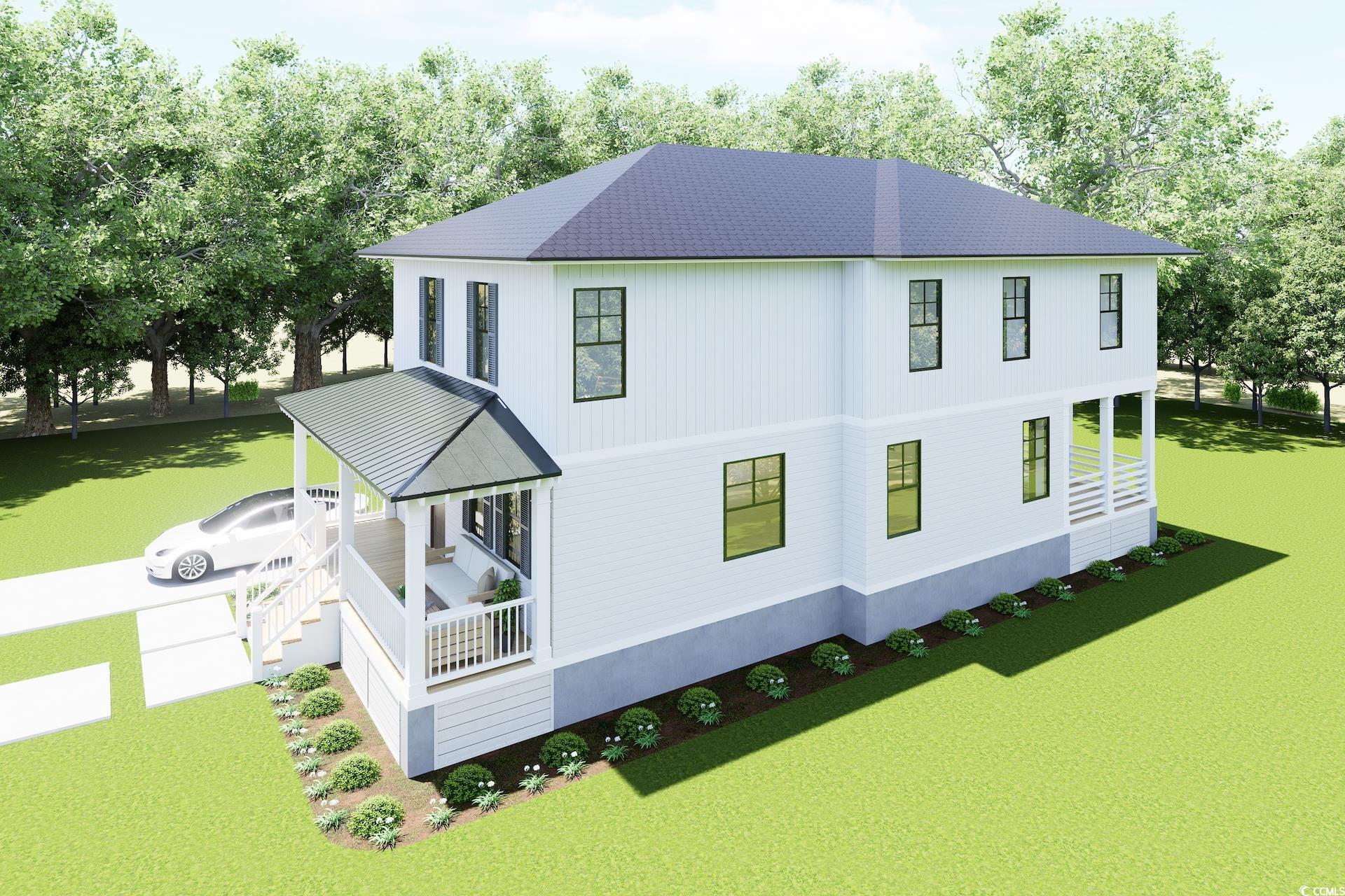 310 King Street Georgetown, SC 29440 - Photo 2 of 23 Back of property with covered porch and a yard