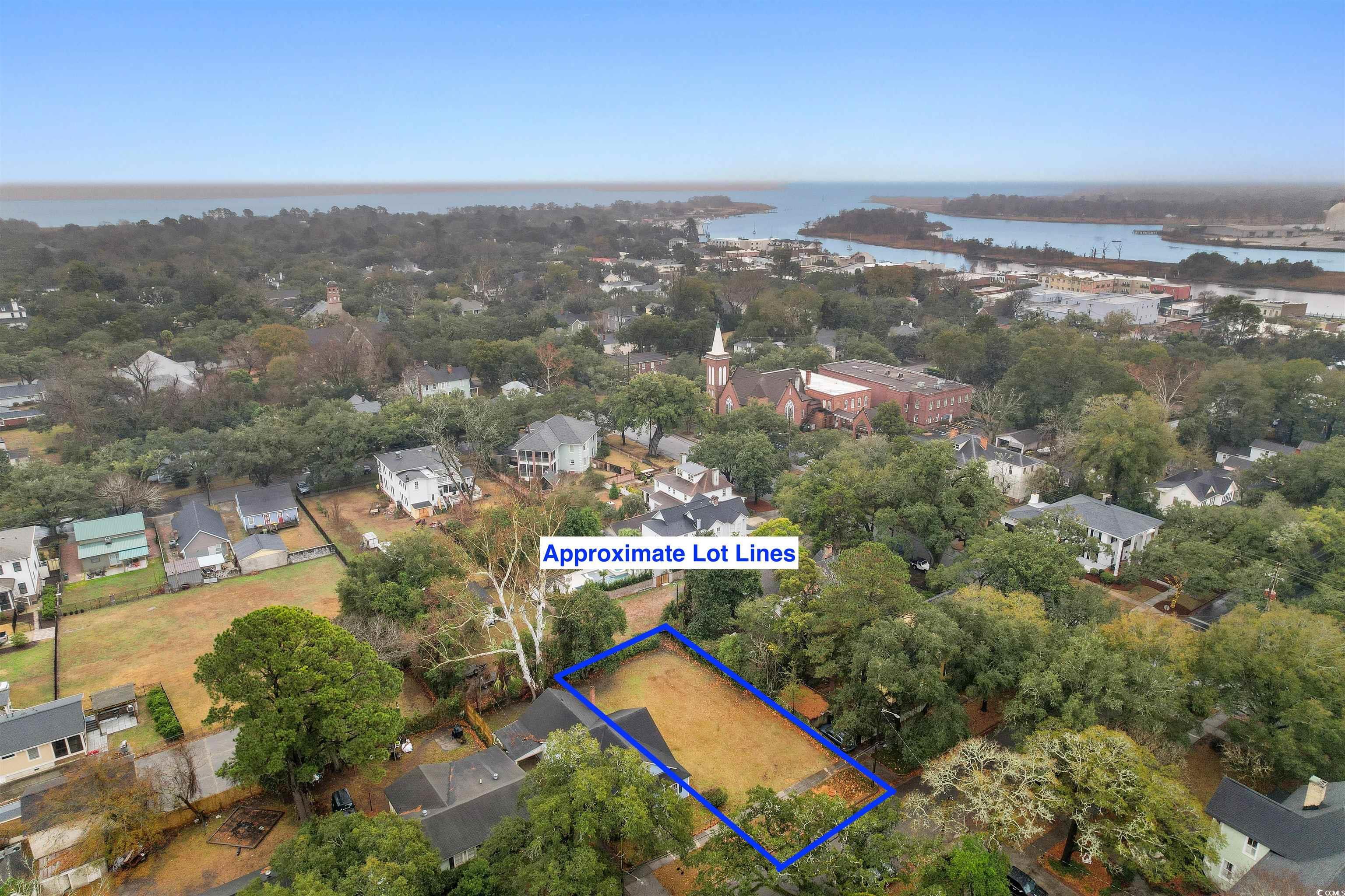 310 King Street Georgetown, SC 29440 - Photo 21 of 23 Aerial view of residential area featuring property parcel outlined and a nearby body of water