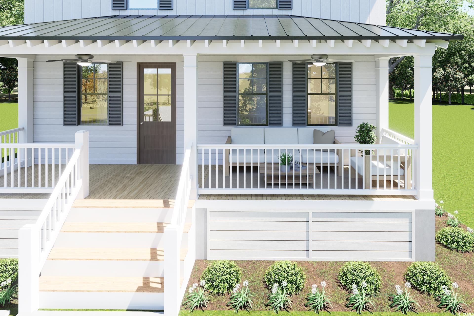 310 King Street Georgetown, SC 29440 - Photo 3 of 23 View of exterior entry featuring a porch, a ceiling fan, and a standing seam roof