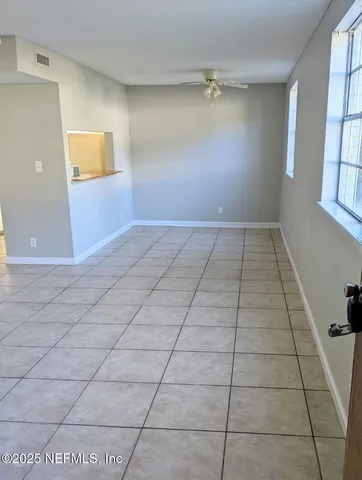 a view of an empty room and window