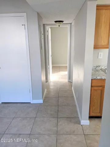 a view of entryway with a window and a door