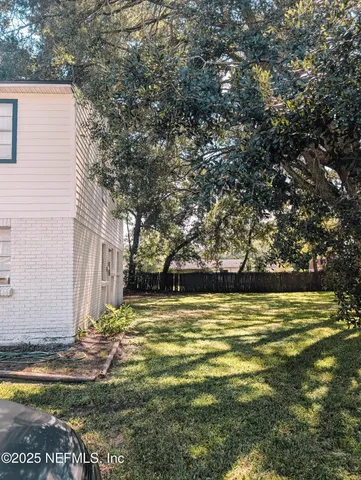 a view of a swimming pool with an outdoor space and seating area