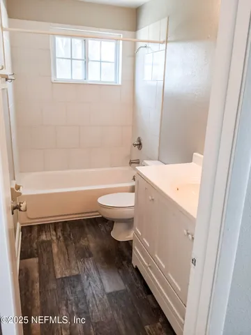 a bathroom with a toilet a sink and a bathtub