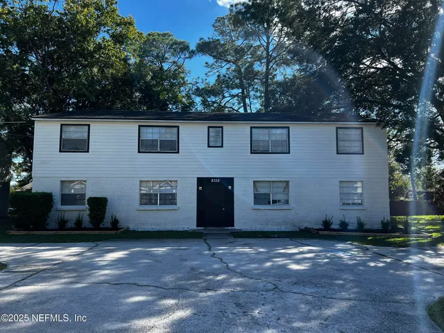 a view of a house with a street