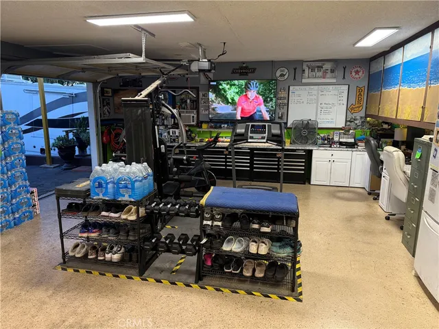a room with furniture pool table and windows