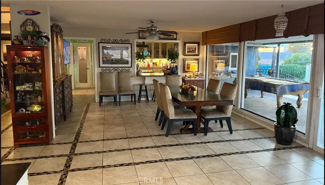 a view of a hallway with closet and chandelier