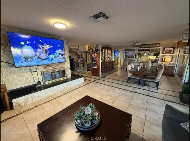 a view of a livingroom with furniture and a flat screen tv