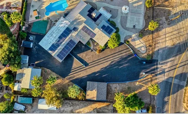 a view of a house with wooden floor and a palm tree
