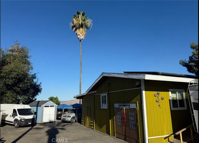 a large white kitchen with a large window