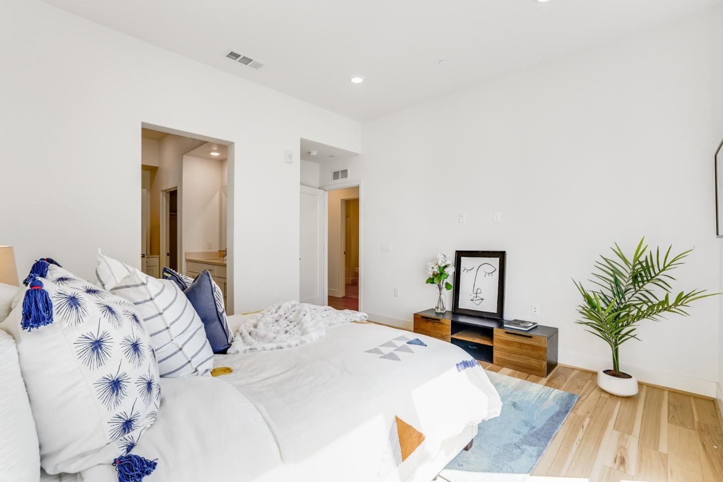 360 Riesling Avenue, Unit 32 Milpitas, CA 95035 - Photo 12 of 32 a bedroom with a bed and a large mirror