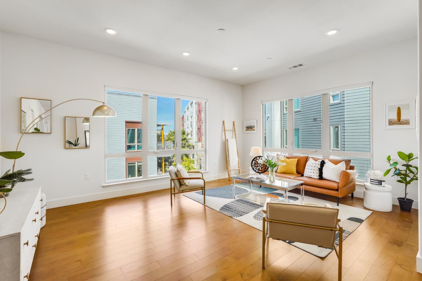 360 Riesling Avenue, Unit 32 Milpitas, CA 95035 - Photo 2 of 32 a living room with furniture and wooden floor