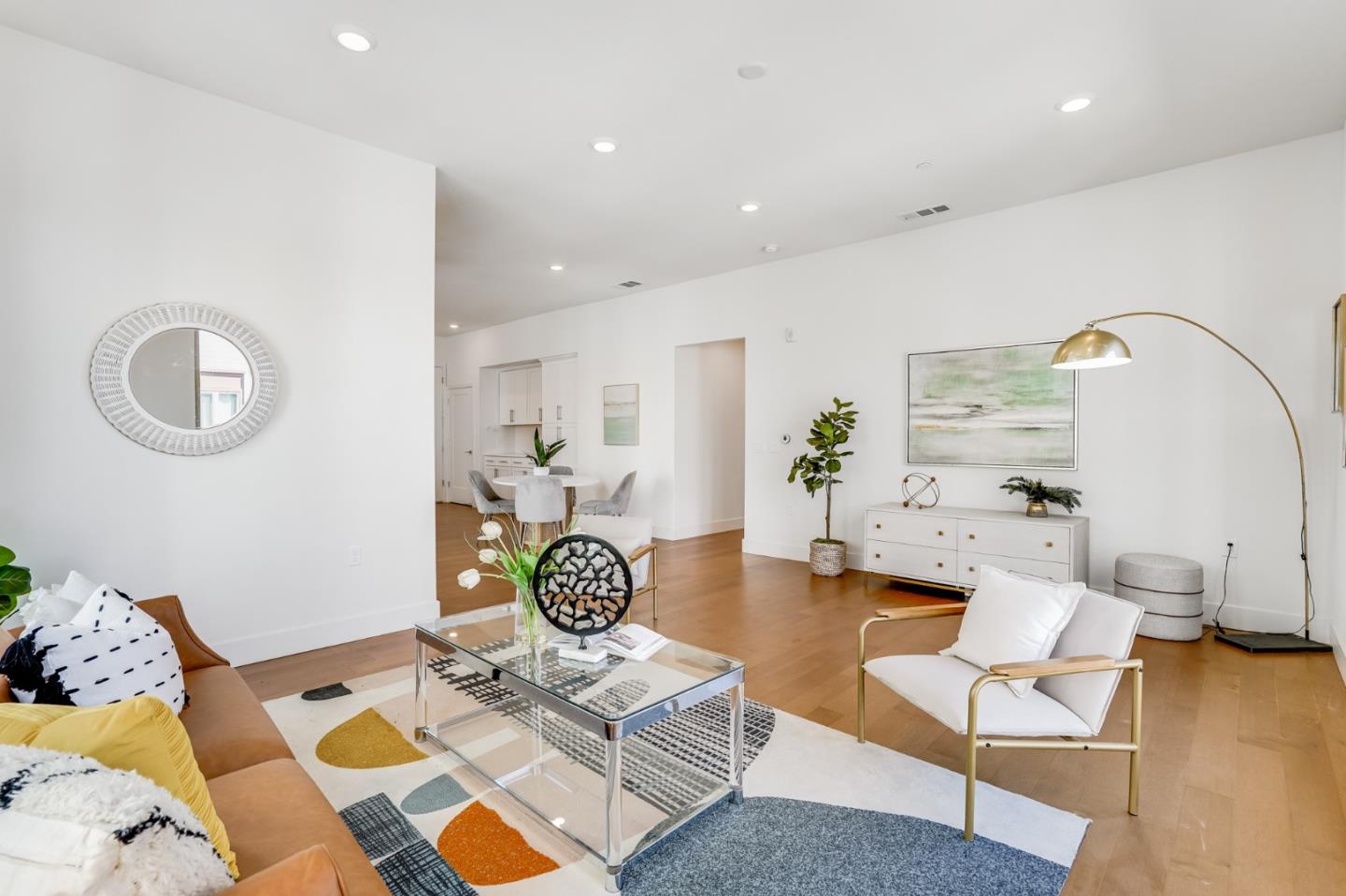 360 Riesling Avenue, Unit 32 Milpitas, CA 95035 - Photo 3 of 32 a living room with furniture and wooden floor