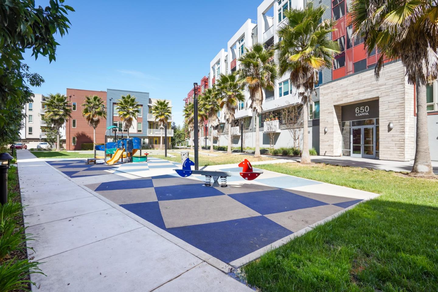 360 Riesling Avenue, Unit 32 Milpitas, CA 95035 - Photo 31 of 32 a view of a yard with palm trees