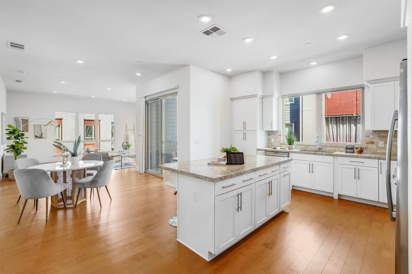360 Riesling Avenue, Unit 32 Milpitas, CA 95035 - Photo 7 of 32 a large white kitchen with lots of counter space a sink and appliances