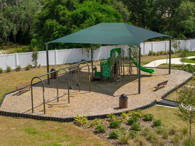 a swimming pool with some trees in the background