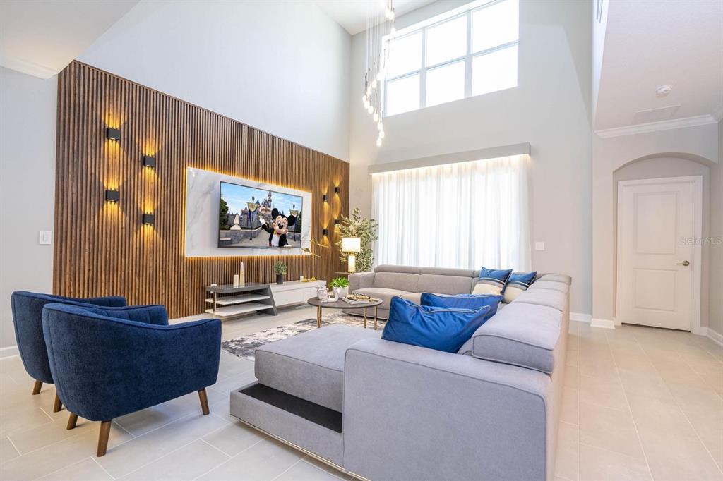 8964 Takeaway Way Davenport, FL 33896 - Photo 35 of 71 a living room with furniture and a large window