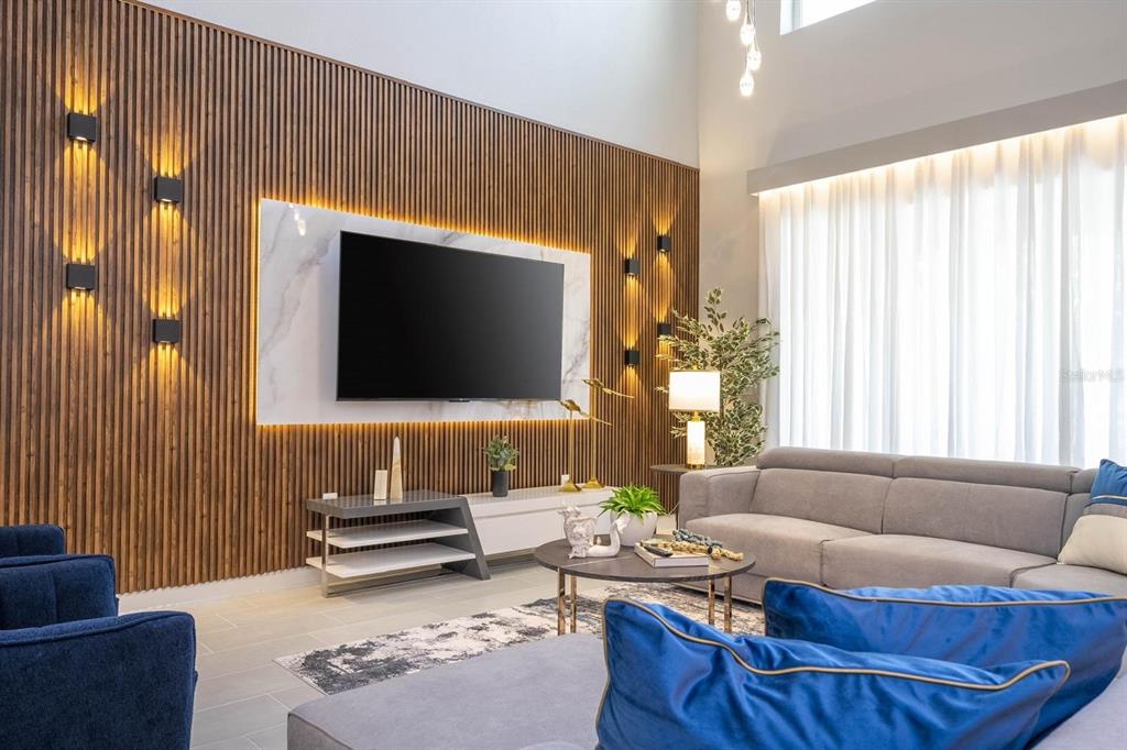 8964 Takeaway Way Davenport, FL 33896 - Photo 37 of 71 a living room with furniture and a flat screen tv