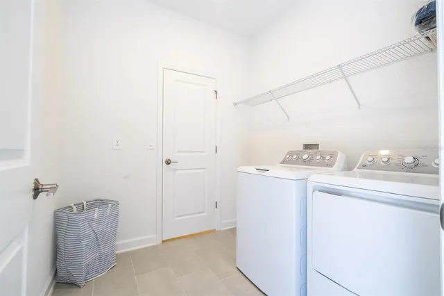 an aerial view of residential houses with yard