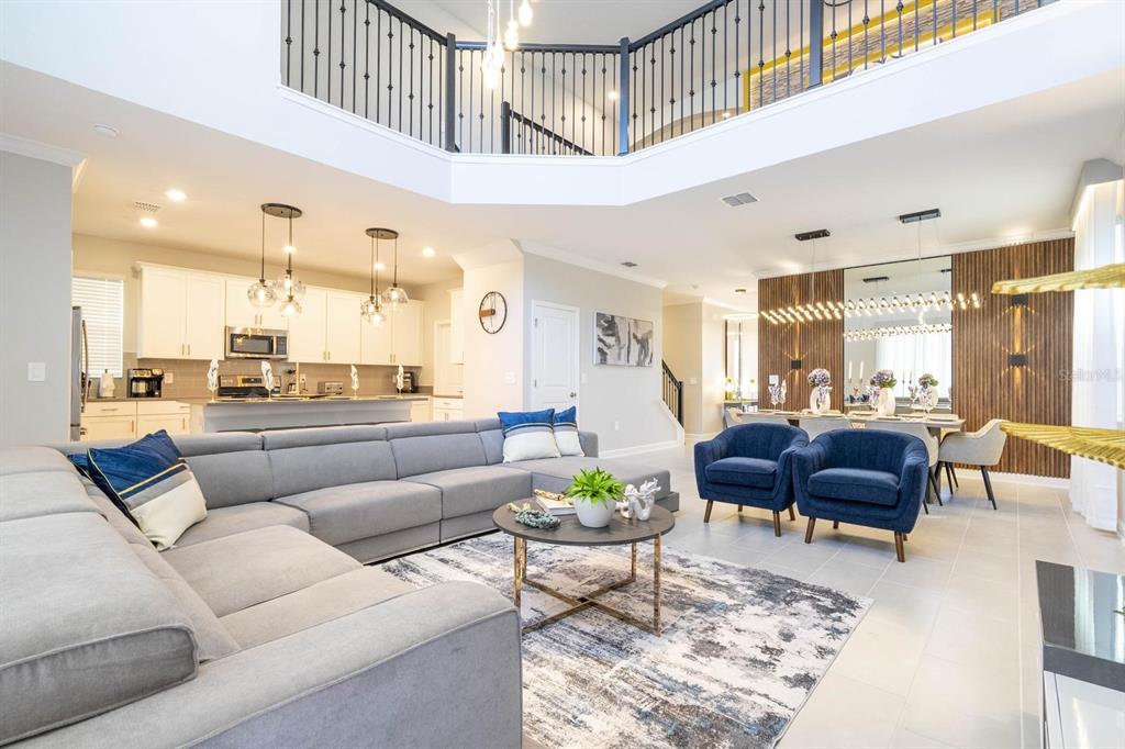 8964 Takeaway Way Davenport, FL 33896 - Photo 40 of 71 a living room with furniture and a large window
