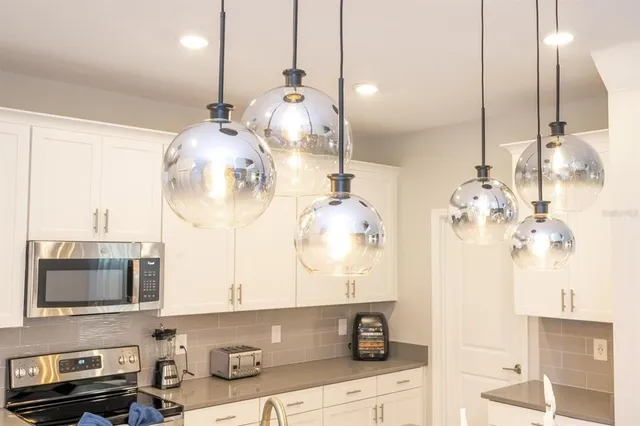 a view of a patio with couches and potted plants