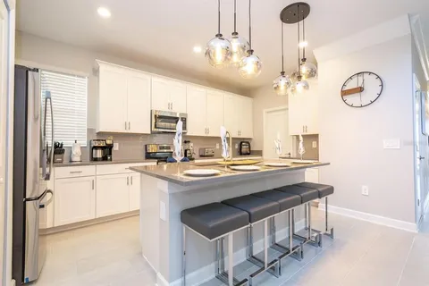 a view of a swimming pool with furniture