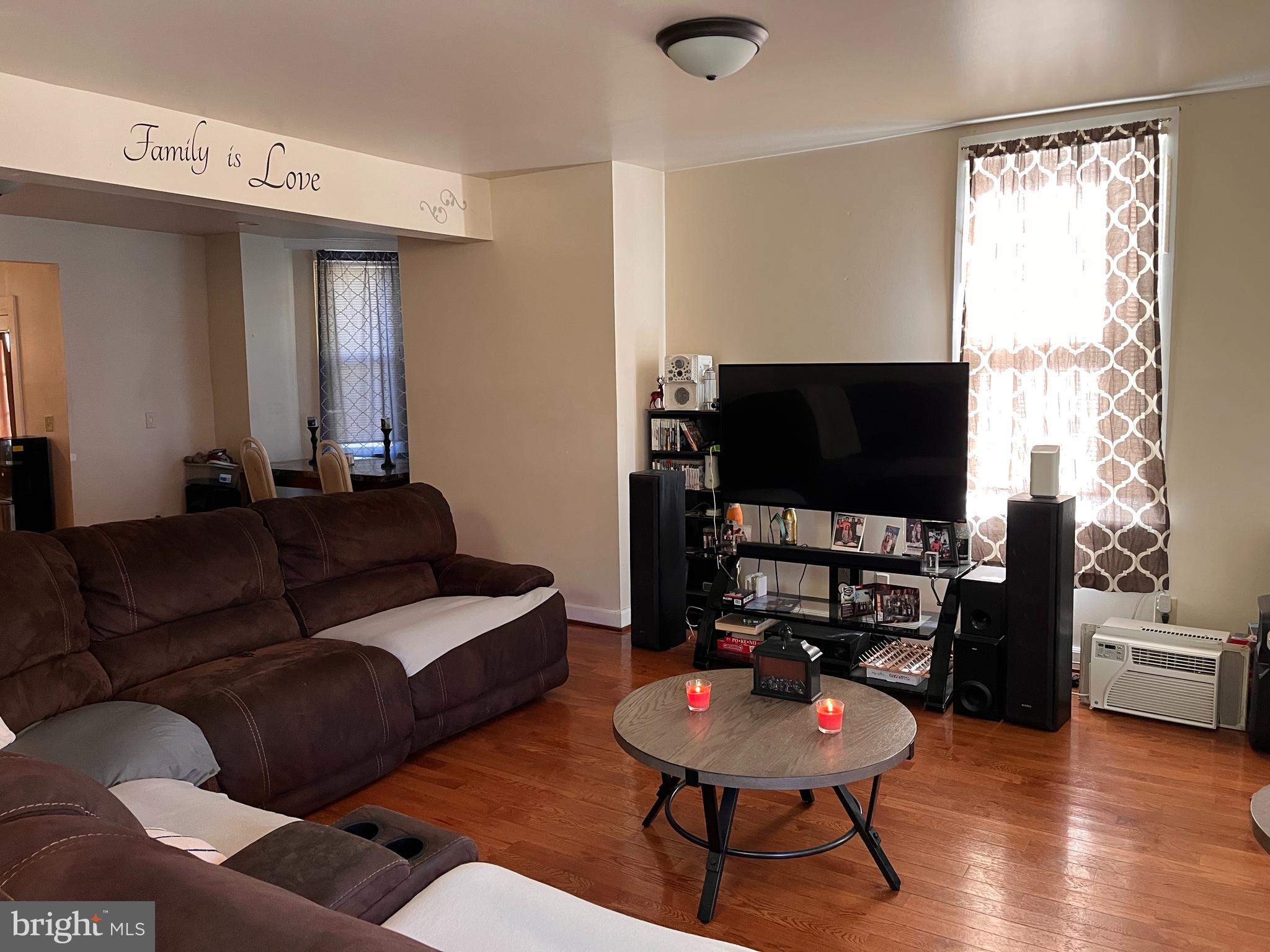179 South 2nd Street Steelton, PA 17113 - Photo 2 of 19 a living room with furniture and a flat screen tv