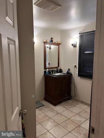 a room with a refrigerator and a stove