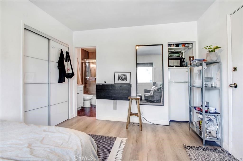 11258 Ohio Avenue Los Angeles, CA 90025 - Photo 9 of 19 a bedroom with a bed and a flat screen tv