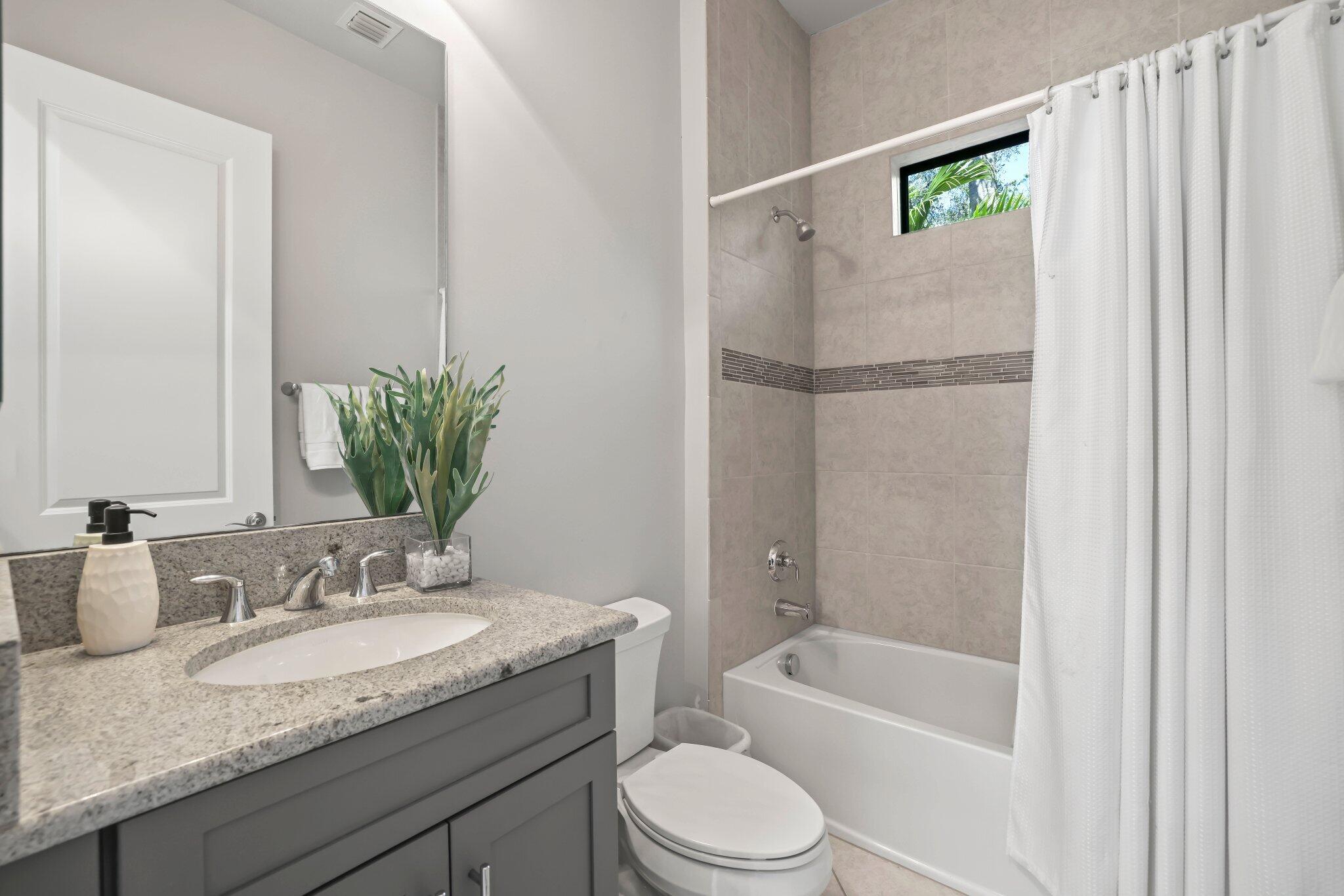 7015 Northwest 27th Avenue Boca Raton, FL 33496 - Photo 29 of 80 Bathroom 1st floor