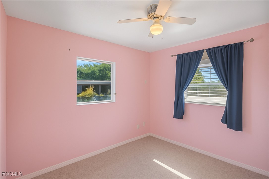 1440 Mandel Road Fort Myers, FL 33919 - Photo 16 of 40 a view of an empty room with a window